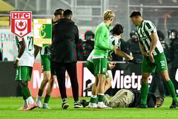 Tumulte nach Regionalliga-Partie: Fans gehen auf Chemie-Spieler los, ein Anhänger am Boden