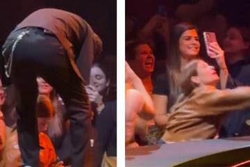 Justin Timberlake sings for front-row fan – but she's too busy on her phone to notice