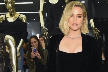 Has Khloé Kardashian "distanced" herself from her jeans brand due to drama with co-founder?