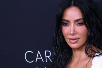 Kim Kardashian steps out with new hairstyle – and broken foot – at SKIMs flagship opening