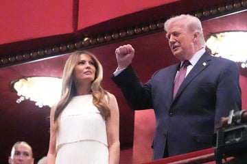 Donald and Melania Trump greeted with boos and cheers at Kennedy Center event