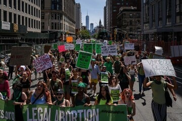 Abortion rights protesters turn Times Square green on July 4th in NYC