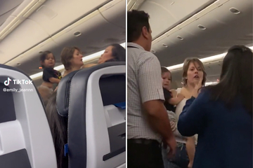 Passenger attacks flight attendant while holding a baby in wild viral video: "I will kill you!"