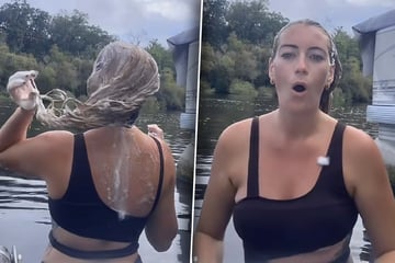 Frau wäscht Haare im Fluss: Plötzlich bemerkt sie, dass sie nicht allein ist
