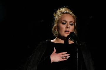 Adele sobs on stage after emotional moment with a fan at Vegas show