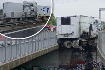 Unfall A17: Kirsch-Lkw rast gegen Brücke und bleibt meterhoch über dem Abgrund hängen