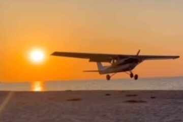 Plane crash lands on Long Island beach at sunset