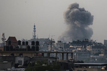 Israel bombs south and north of Gaza amid mass Palestinian exodus from Rafah