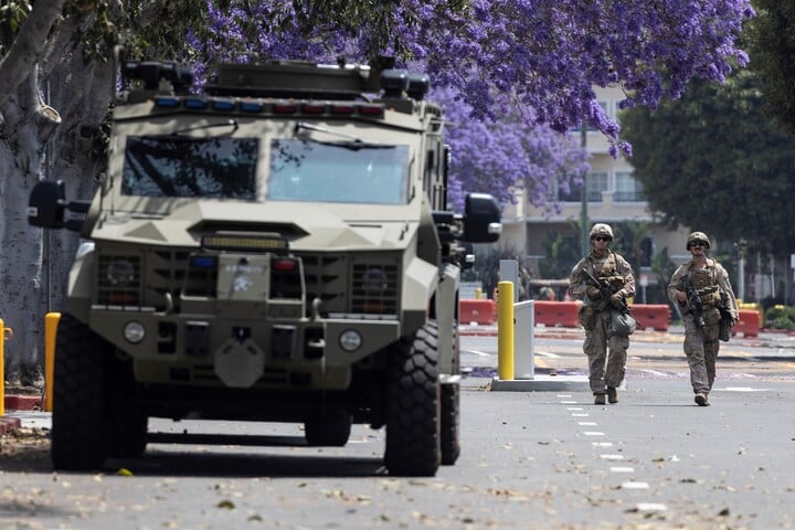 First wave of marines deployed by Trump arrive in LA amid protest standoff
