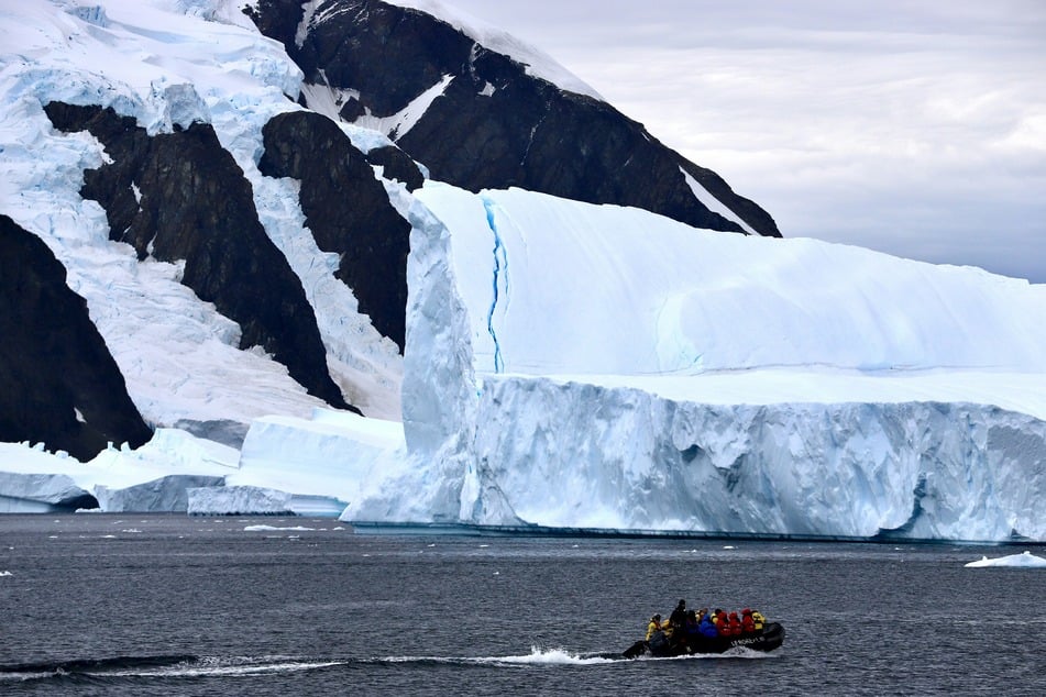 The amount of ice melting or breaking off into the ocean from Greenland and Antarctica (pictured), now averaging about 400 billion tons a year, has quadrupled over the last three decades.