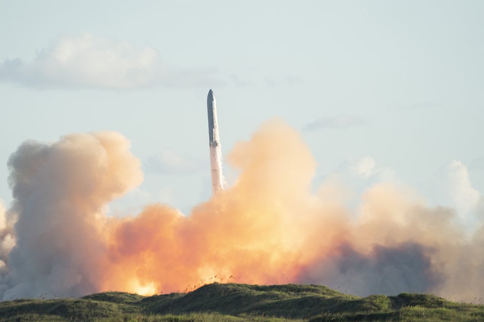 SpaceX's massive Starship rocket soared through Texas's golden-hour skies Monday before splashing down successfully.