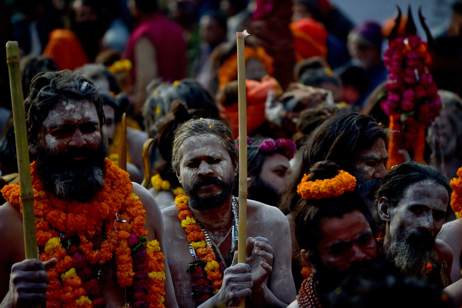 Naga Sadhus take part in a religious procession during Peshwai for the upcoming Maha Kumbh Mela in Prayagraj, India.