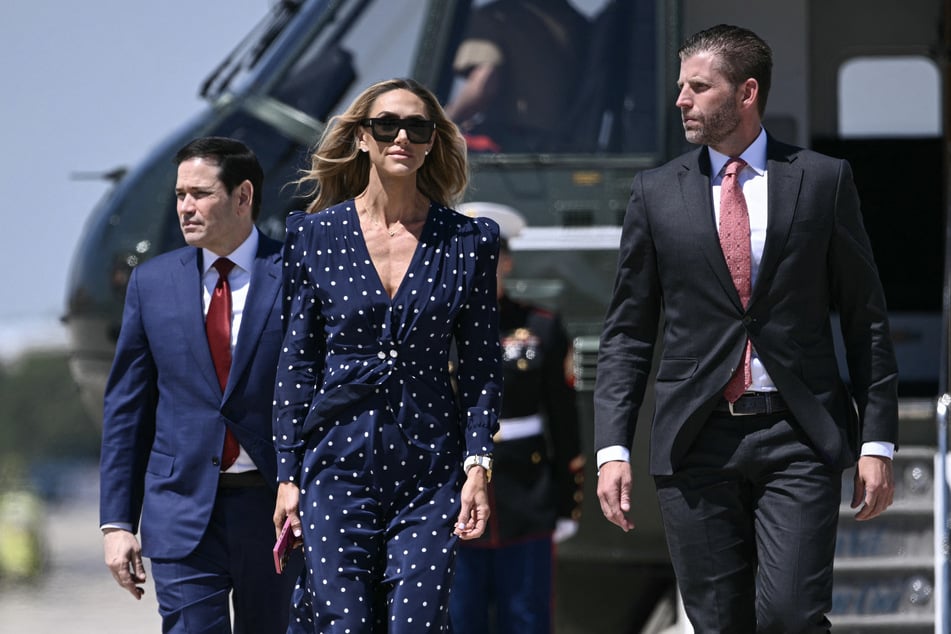 L. to r.: Secretary of State Marco Rubio, Lara Trump, and Eric Trump walk to board Air Force One at Joint Base Andrews, Maryland, on May 12, 2026.
