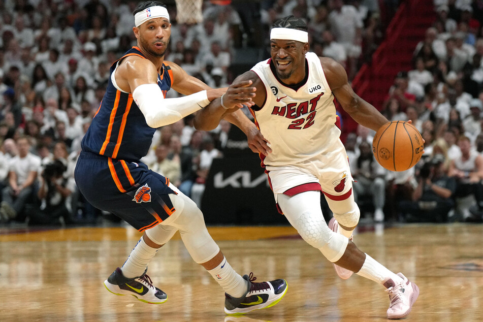 Miami Heat forward Jimmy Butler drives past New York Knicks guard Trevor Keels in the second half during Game 6 of the 2023 NBA playoffs at Kaseya Center.