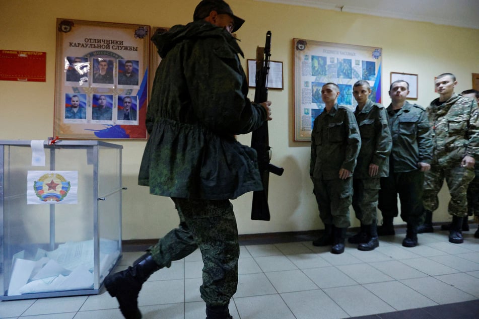 A pro-Russian service member casts his vote in the separatist region of Luhansk, Ukraine.