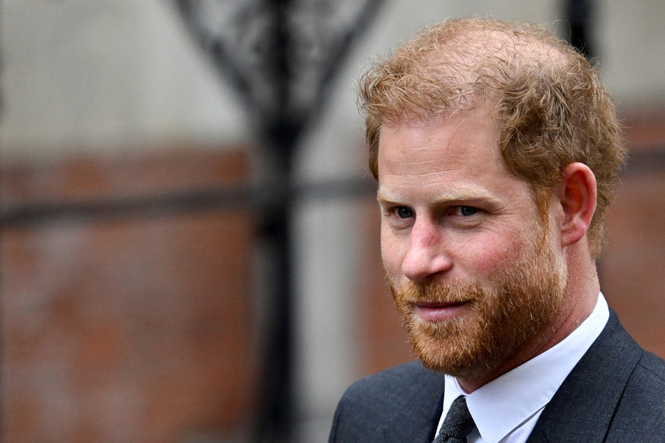 A British tabloid publisher has "unreservedly" apologized to Prince Harry for illegally gathering information on him.