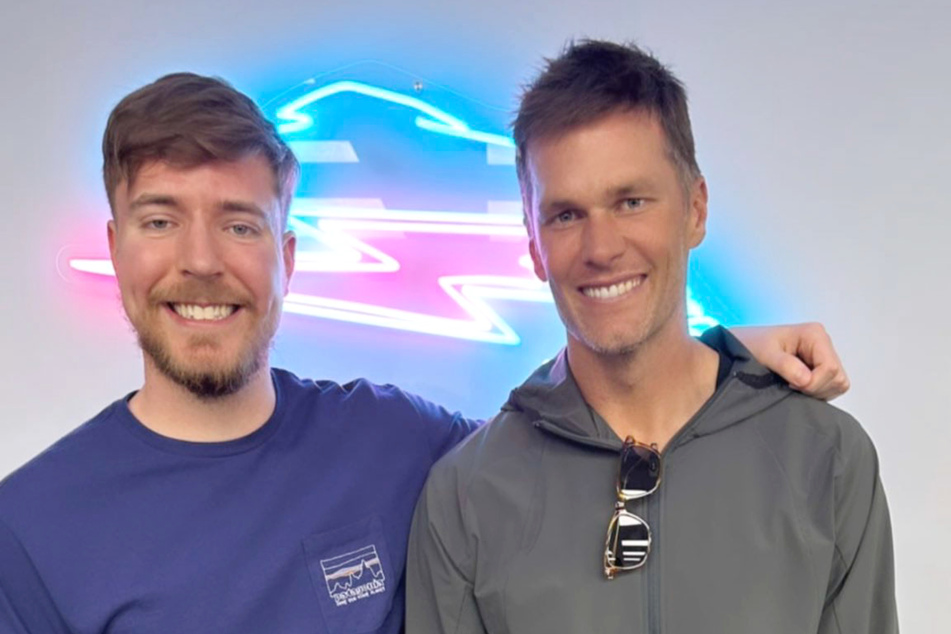 Former NFL quarterback Tom Brady made a surprise trip to Greenville, North Carolina, notably visiting YouTube star MrBeast (l.).