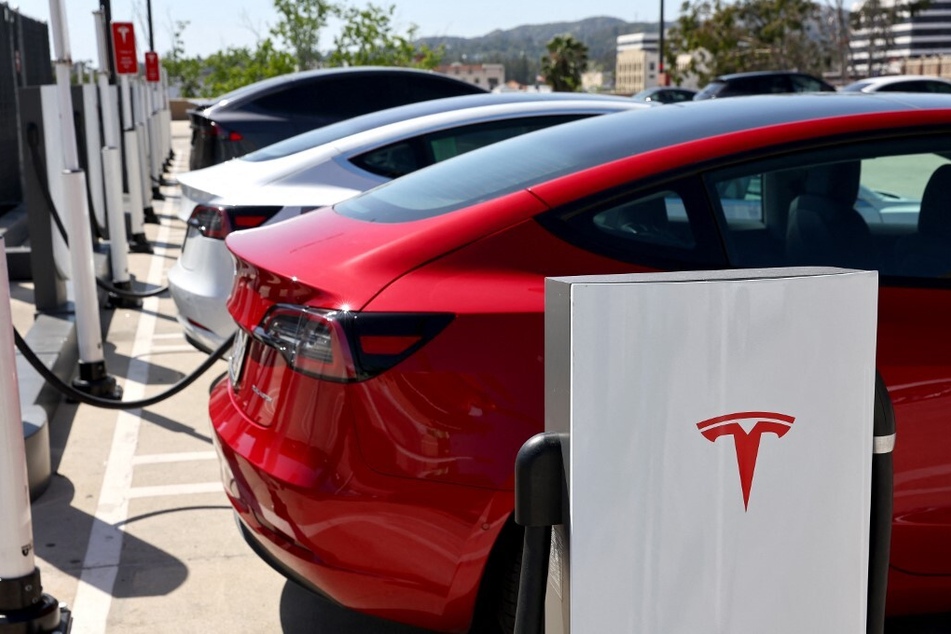 Tesla cars recharge at a Tesla Supercharger station in Pasadena, California.