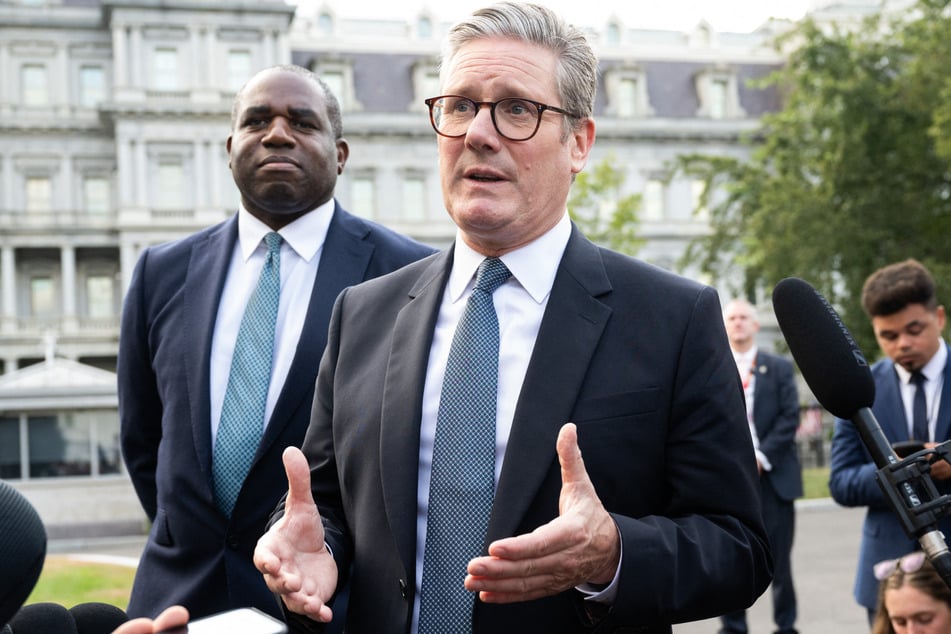 Keir Starmer (c.) told reporters at the White House that he had a "wide-ranging discussion about strategy" with Biden but that it "wasn't a meeting about a particular capability."