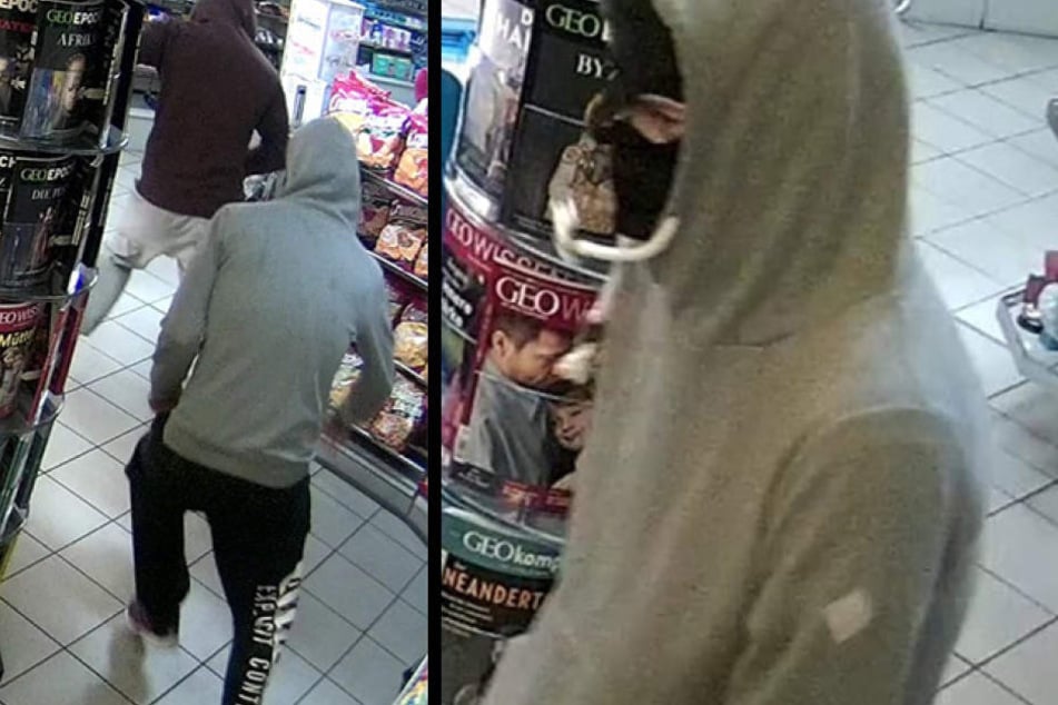 Einer der Täter trug einen grauen Kapuzen-Pullover.