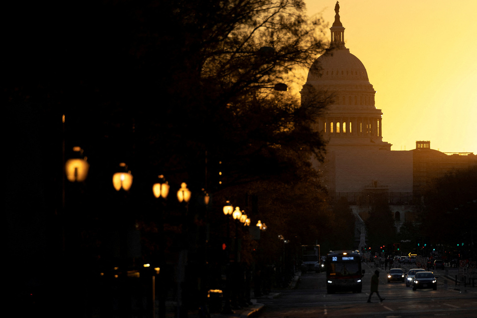 The sun rises over the US Capitol as control of Congress remains unclear following the 2022 midterm elections.