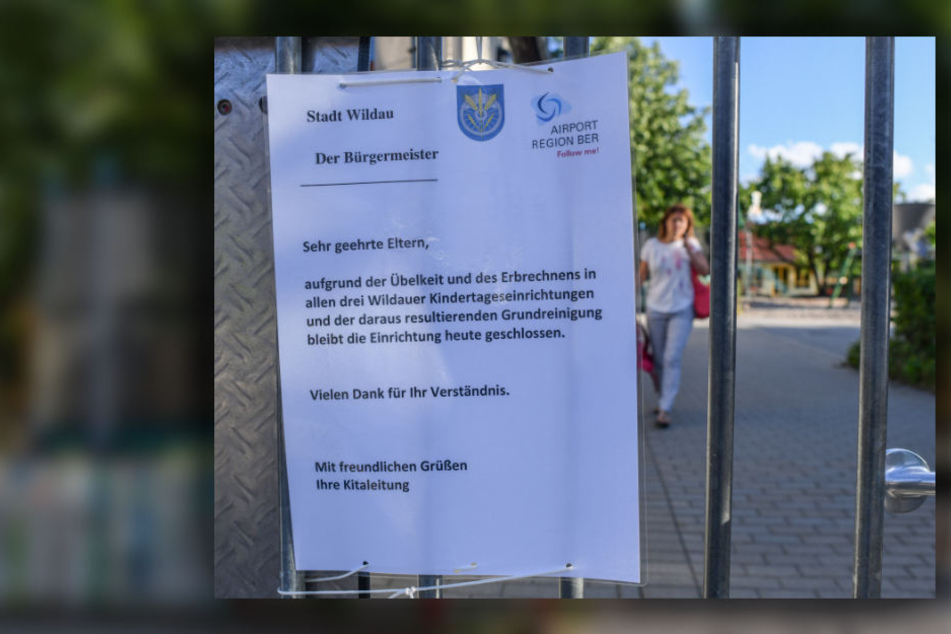 Ein Zettel mit einem Hinweis, dass alle drei Wildauer Kindertageseinrichtungen aufgrund von Übelkeit und Erbrechen heute geschlossen bleiben, hängt an einem Tor der Kita Wirbelwind.
