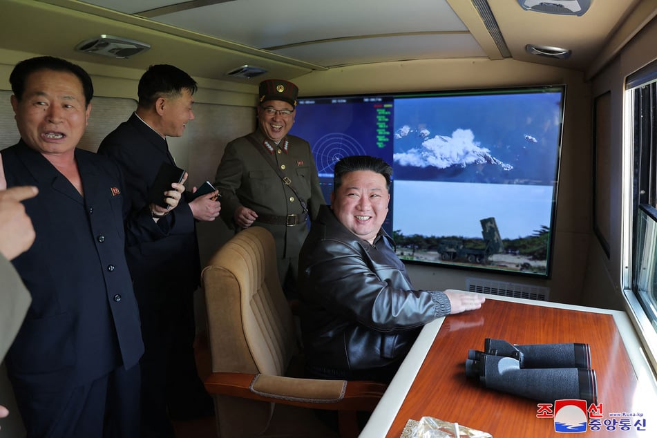 This picture taken on May 17, 2024 and released from North Korea's official Korean Central News Agency (KCNA) on May 18, 2024 shows North Korean leader Kim Jong Un inspecting a test fire of a tactical ballistic missile into which a new autonomous navigation system at an undisclosed location in North Korea.