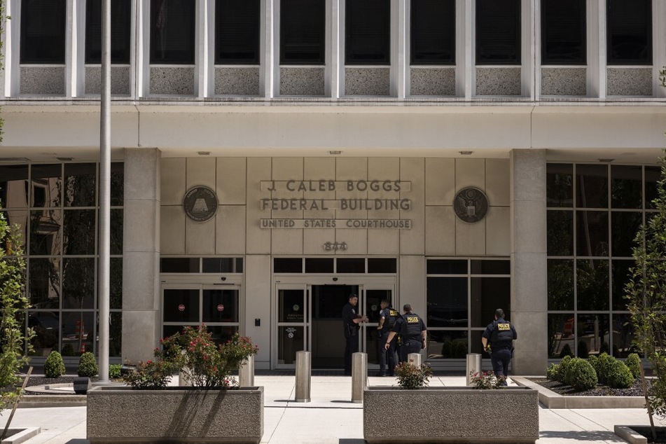 Police officers enter the J. Caleb Boggs Federal Building in Wilmington, Delaware, on July 26, 2023.