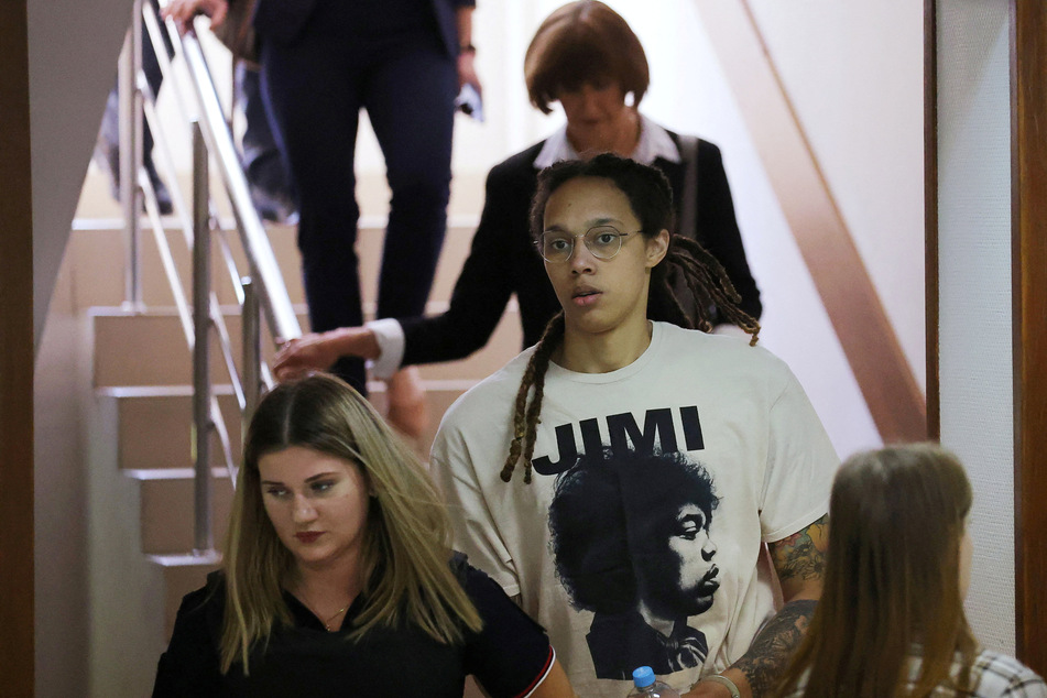 Brittney Griner (2nd from l.) being escorted to a courtroom in Khimki outside Moscow on July 1.