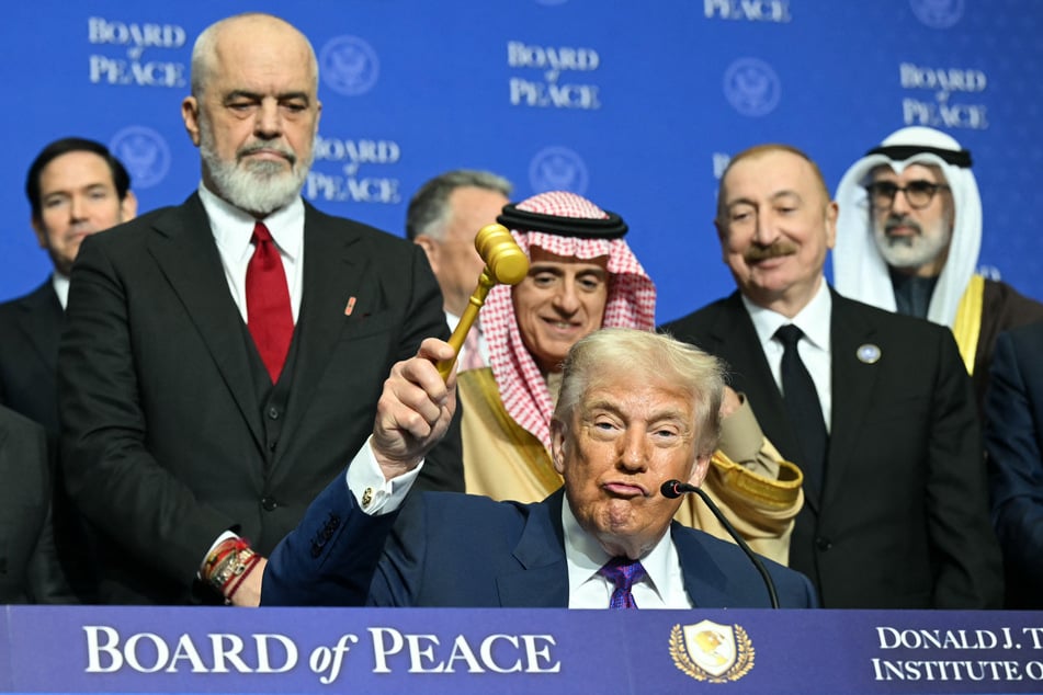 US President Donald Trump holds a gavel during a signing ceremony at the inaugural meeting of the "Board of Peace" at the US Institute of Peace in Washington, DC, on Thursday.