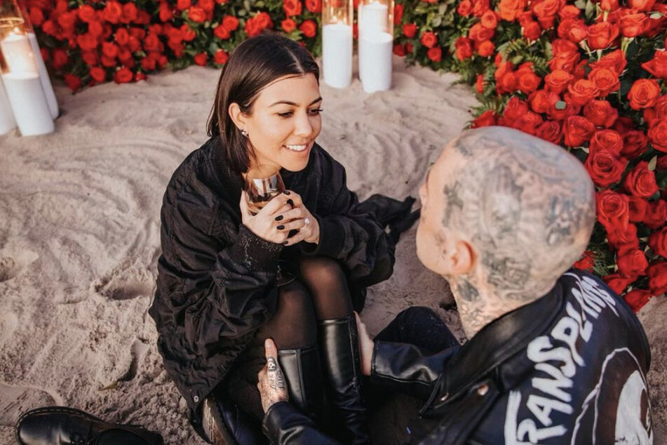 Kourtney Kardashian and Travis Barker gush after the reality star accepts the musician's proposal.