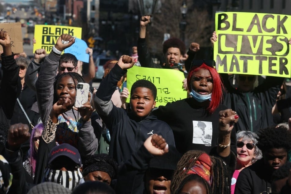 Protesters rally in front of the Michigan State Capitol to demand accountability after the police killing of Patrick Lyoya.