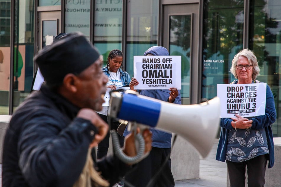 Supporters of Chairman Omali Yeshitela and the Uhuru Three rally outside the American embassy in London.