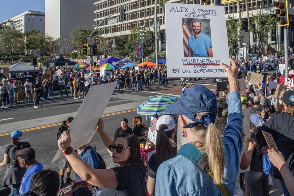 A protester in Los Angeles, California, holds a sign with a picture of Alex Pretti in an "ICE Out of Everywhere" National Day of Action on January 31, 2026.