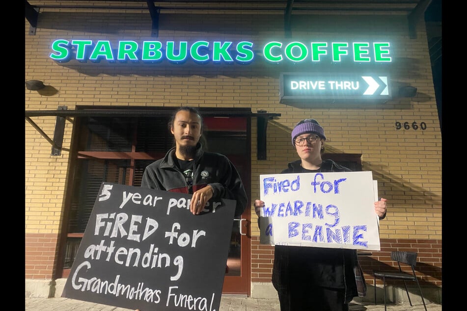 Fired Starbucks workers Michael Sanabria (l.) and Cole Graziano picket outside the Transit Commons store in Buffalo, New York.