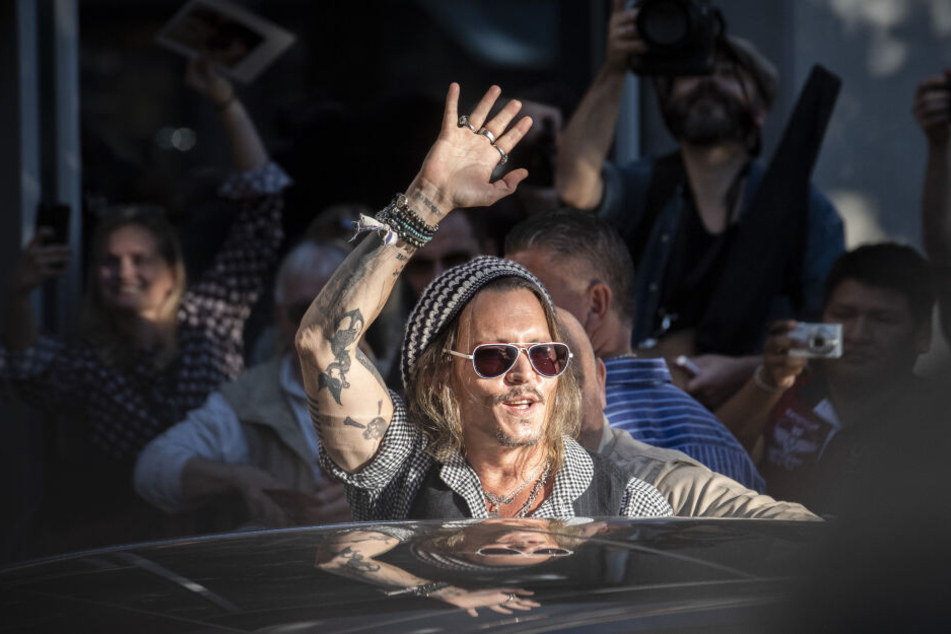 Johnny Depp (55).