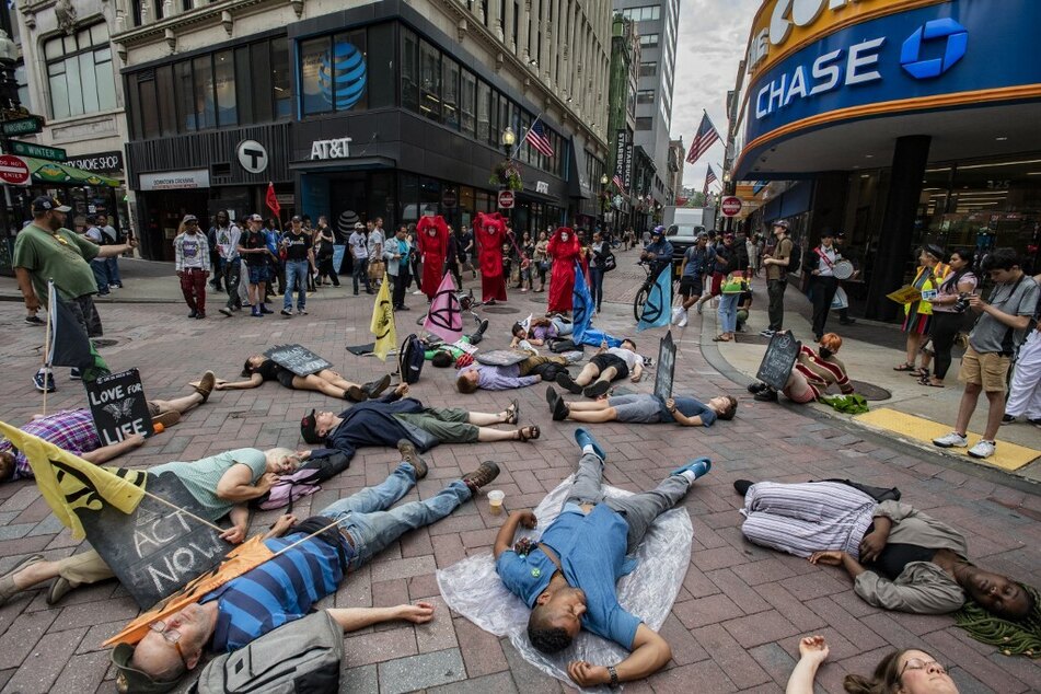 A similar event was staged in Boston earlier this month, when members of performance troupe Red Rebel Brigade joined members of Extinction Rebellion and climate activists during Die-In For Climate Action.