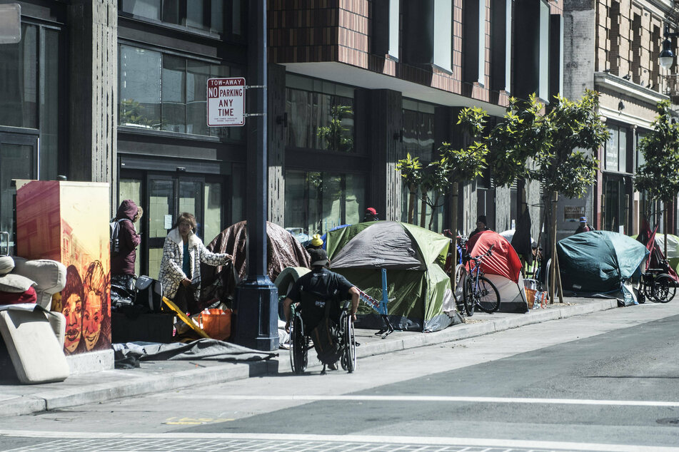 Tents occupy the sidewalk on Eddy Street in the Tenderloin district of San Francisco.