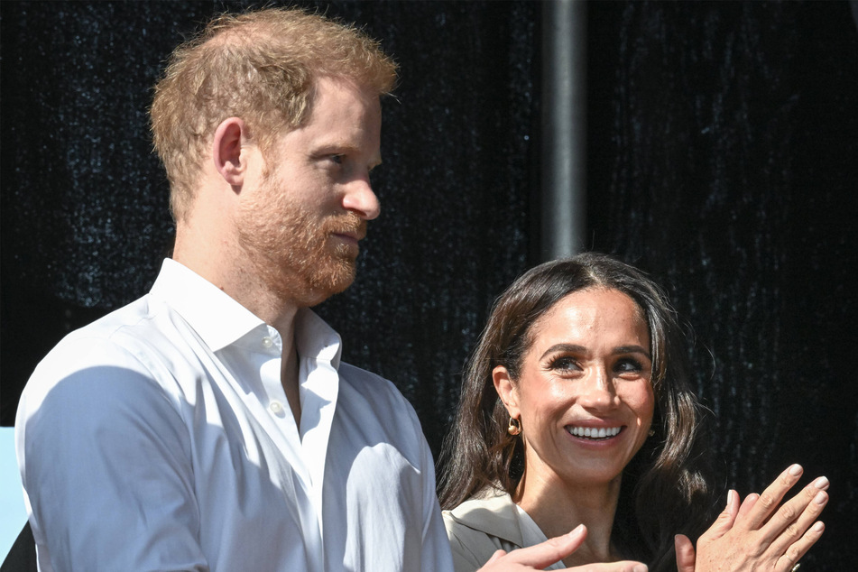 Prince Harry (l.) and Meghan Markle together in September.
