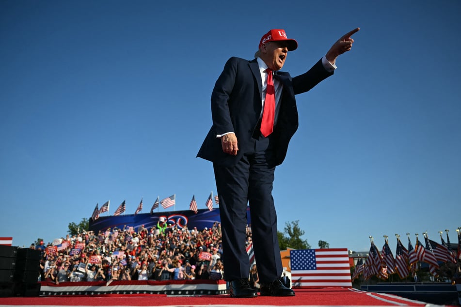 President Donald Trump gestures as he steps on stage to deliver remarks at the Salute to America Celebration at the Iowa State Fairgrounds in Des Moines on Thursday.