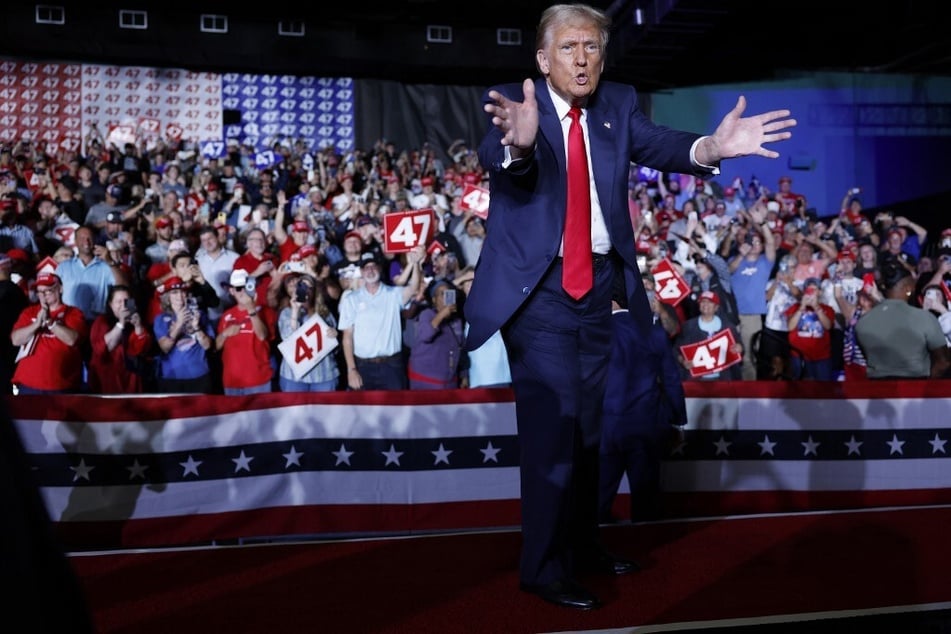 Republican presidential nominee Donald Trump acknowledges supporters after speaking at a campaign rally in Greensboro, North Carolina.