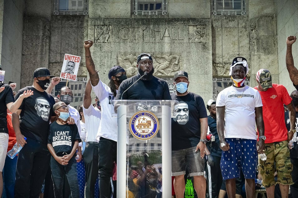 Trae the Truth (c.) speaks outside Houston City Hall during a protest in honor of George Floyd.