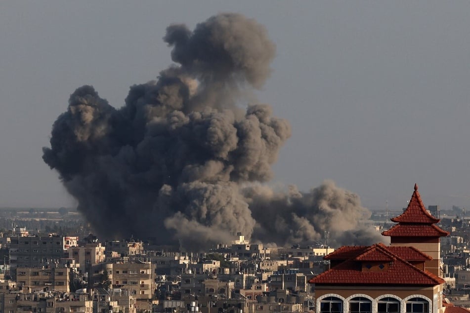 Smoke billows over Khan Younis in the southern Gaza Strip during Israeli bombardment on January 24, 2024.