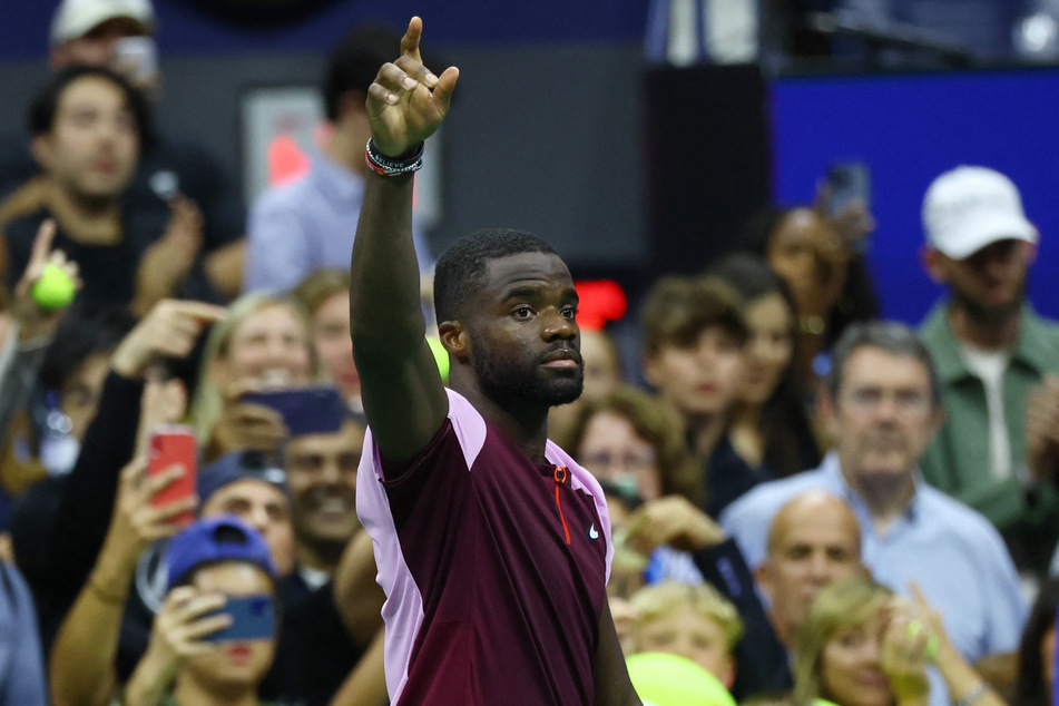 Frances Tiafoe gestures to the crowd after losing his semi final match against Spain's Carlos Alcaraz.
