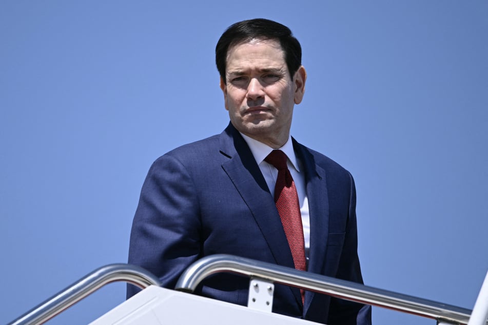 Secretary of State Marco Rubio boards Air Force One at Joint Base Andrews, Maryland, on May 12, 2026, as he departs for a three-day state visit to China.