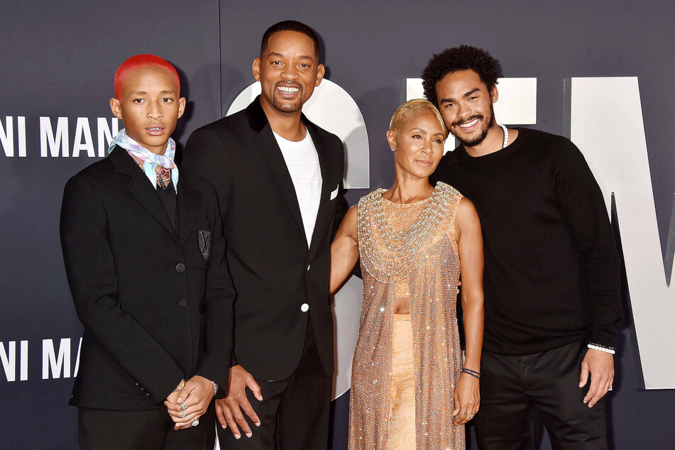 Jada Pinkett-Smith (second from r) with her husband, Will Smith (m) and their sons, Jaden (l) and Trey (r) in 2019.