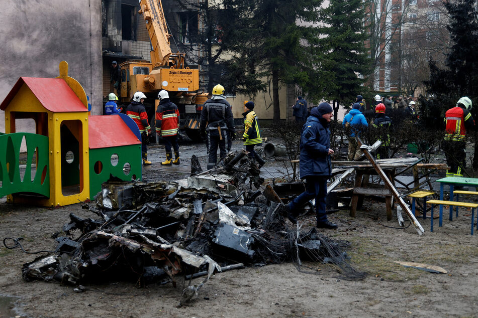 The remains of the Airbus H225 helicopter that crashed near a kindergarten in the Ukrainian town of Brovary.