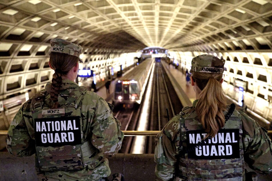 Members of the National Guard patrol the Gallery Place Metro Station in Washington DC on December 3, 2025.