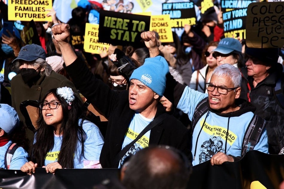 Immigrants and allies in New York City protest Donald Trump and his threat to carry out mass deportations after his 2024 election win.