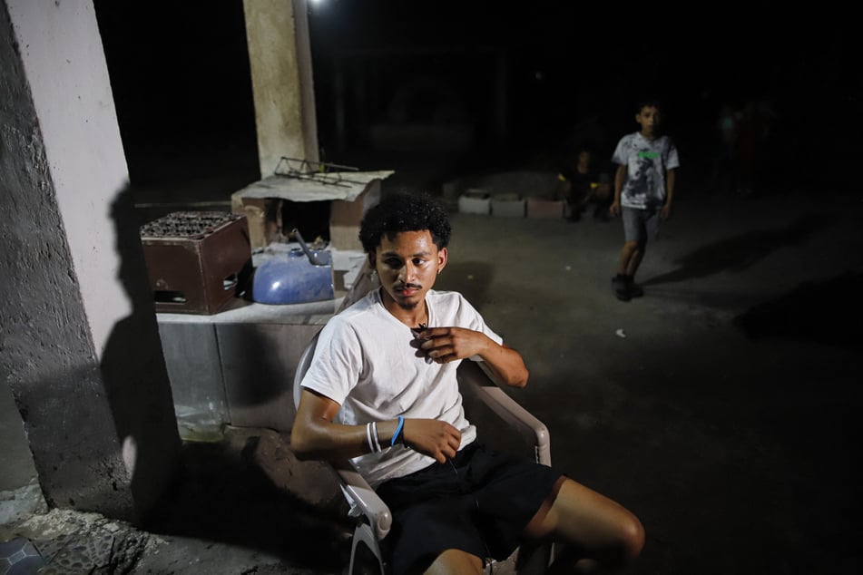 Emerson Colindres spends time with his family at their home in Marcovia, Honduras, on June 24, 2025.